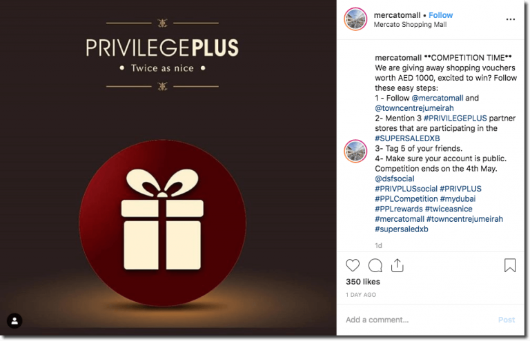 This Instagram post simply shows a stylized cartoon of a gift box, set against a red circle. Above the design, a title reads: "Privilege Plus: twice as nice." The caption invites users to enter a prize draw for shopping vouchers, by commenting on the post with a list of stores participating in the scheme.
