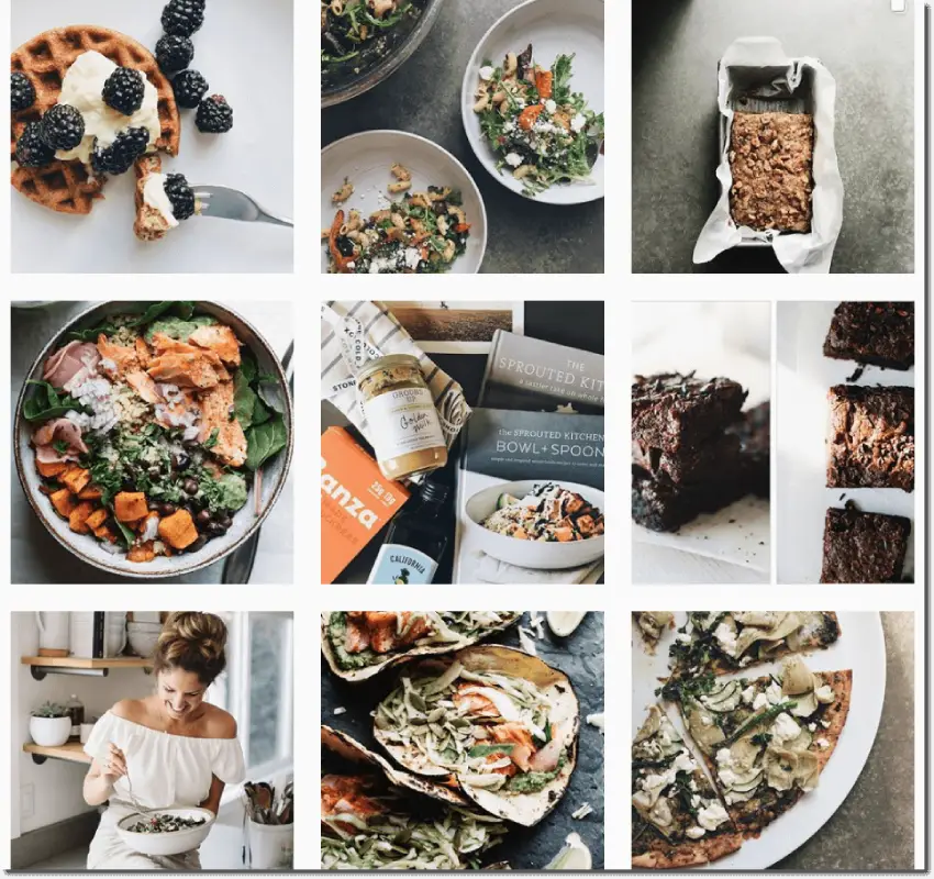 Screenshot of the Sprouted Kitchen Instagram feed. All the images are in cool tones with deep browns and blacks (for example, photos of blackberries or brownies).